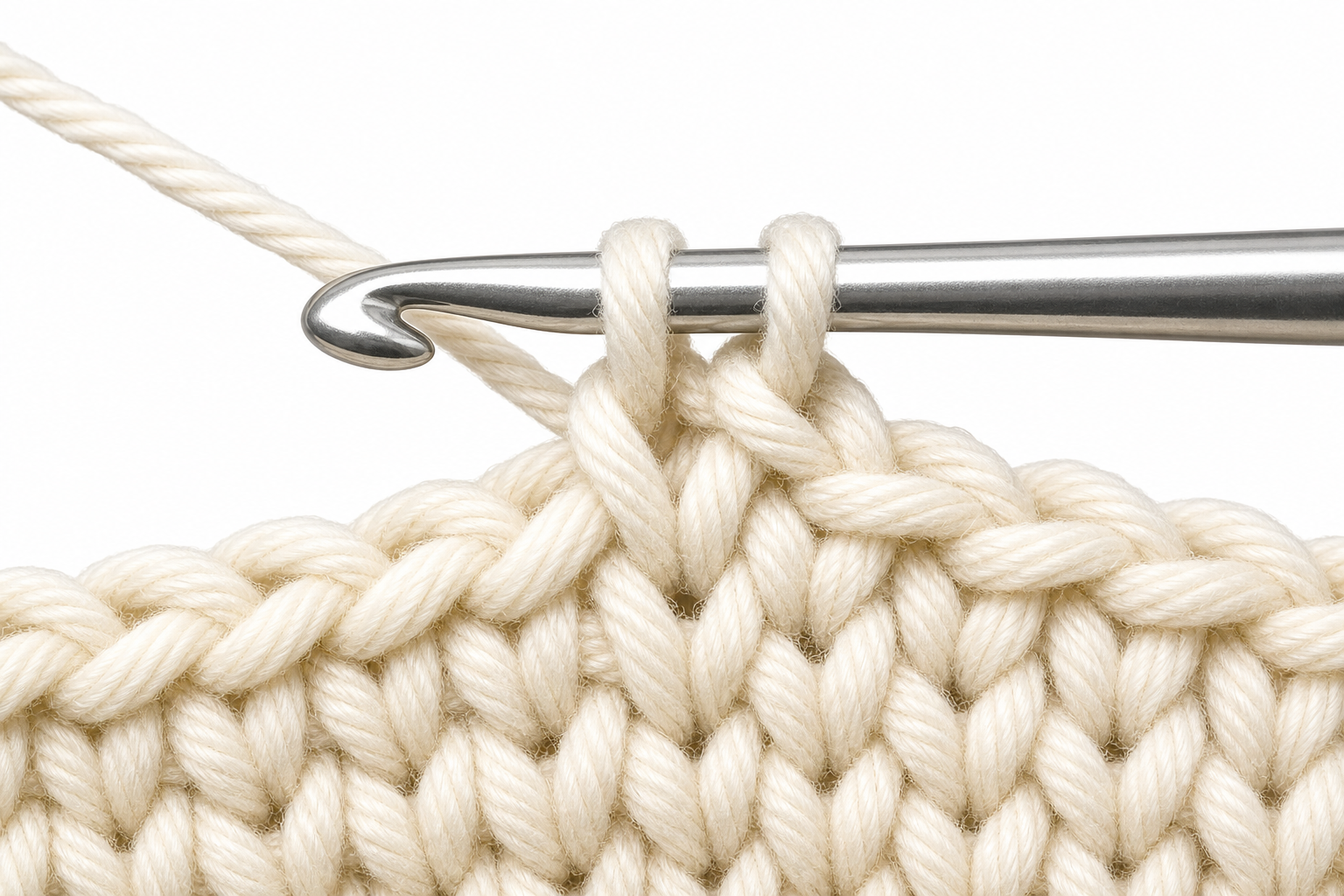 Close-up instructional illustration: single crochet with two loops on the hook